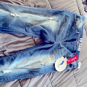Distressed VIP light wash butt lift denim.Size 16